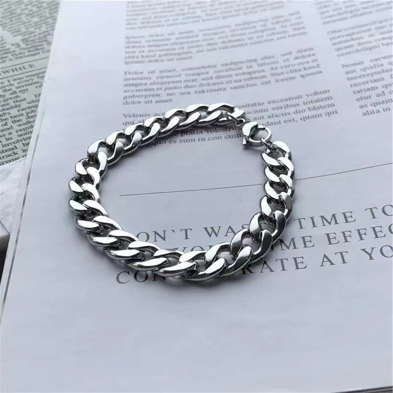 Cuban link bracelet styled on paper