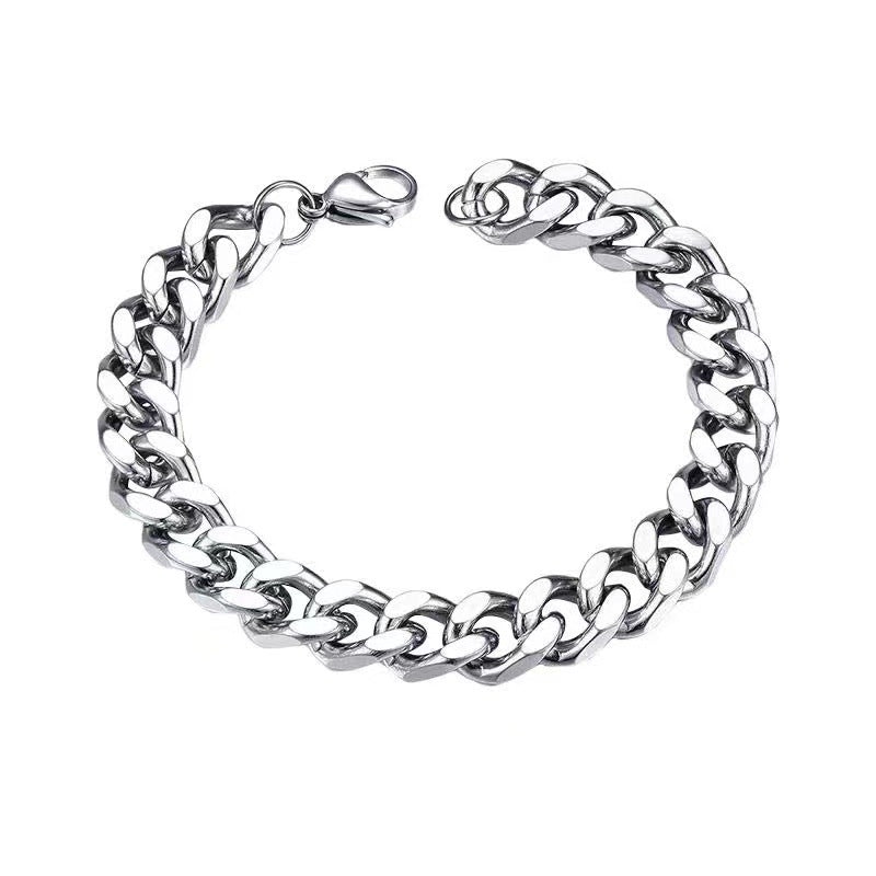 Stainless steel Cuban link bracelet on white background